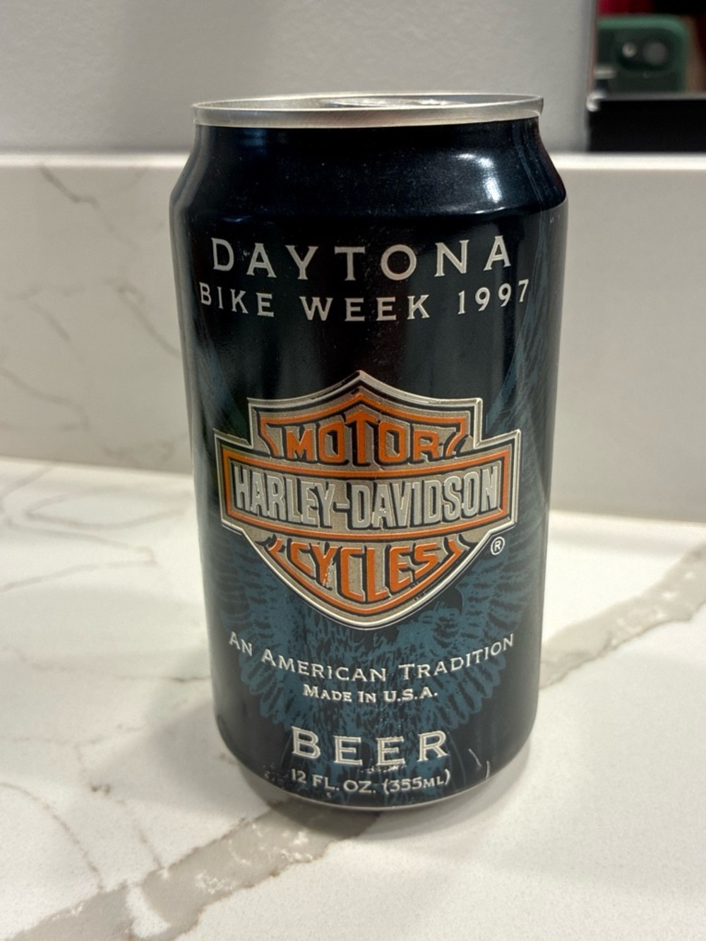 Harley-Davidson Black and Orange Beer Can with Blue Wing Graphics